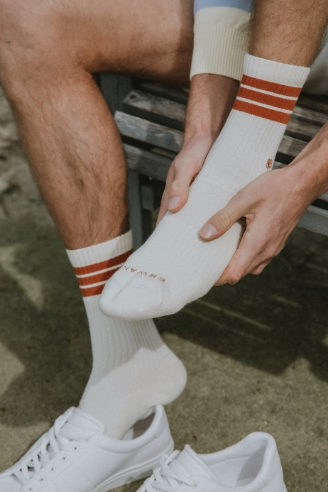 An athlete experiencing discomfort in their foot.
