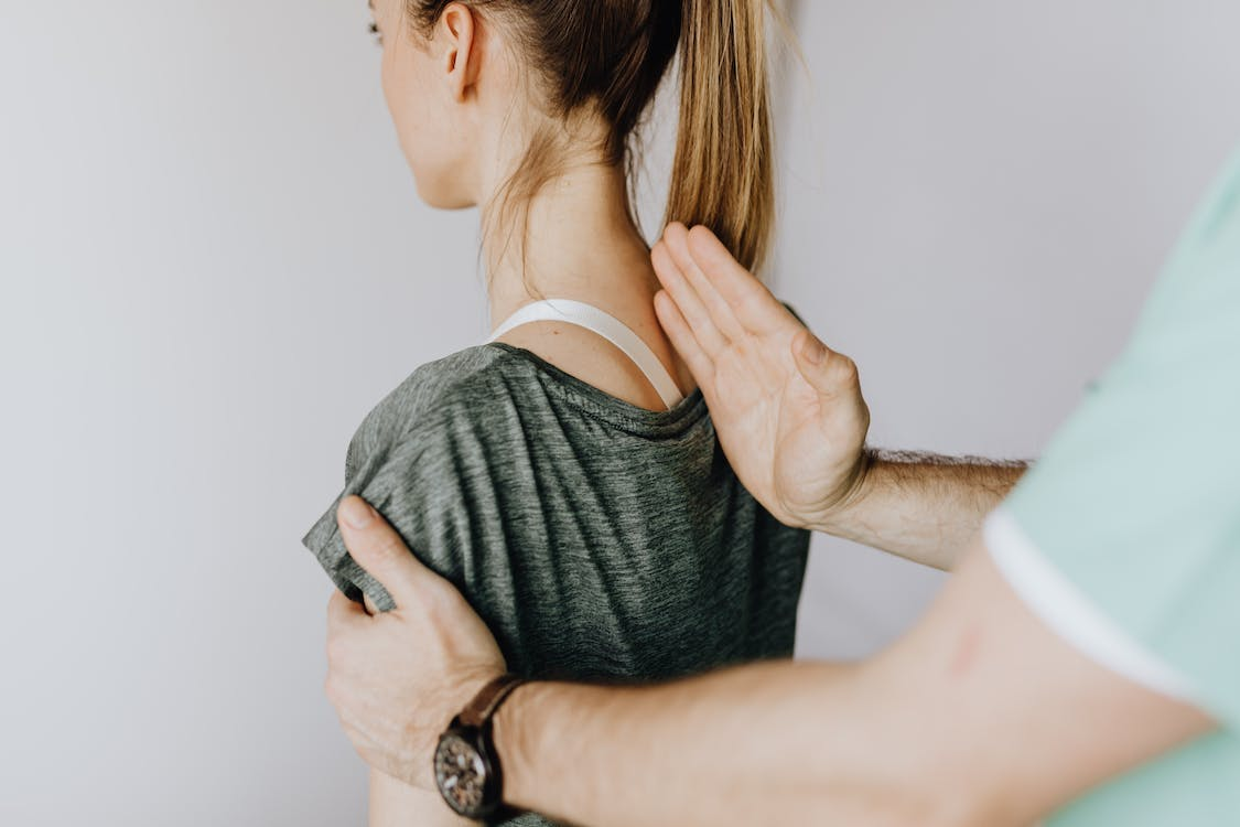 A person visiting a chiropractor for laser treatment