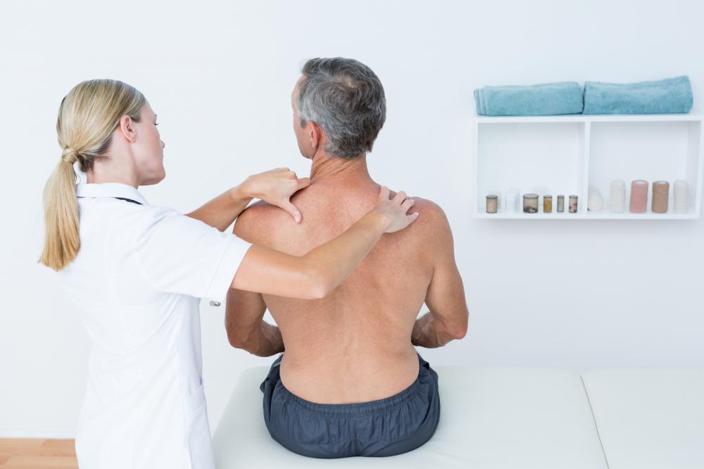 A patient undergoing massage therapy for trigger point pain.