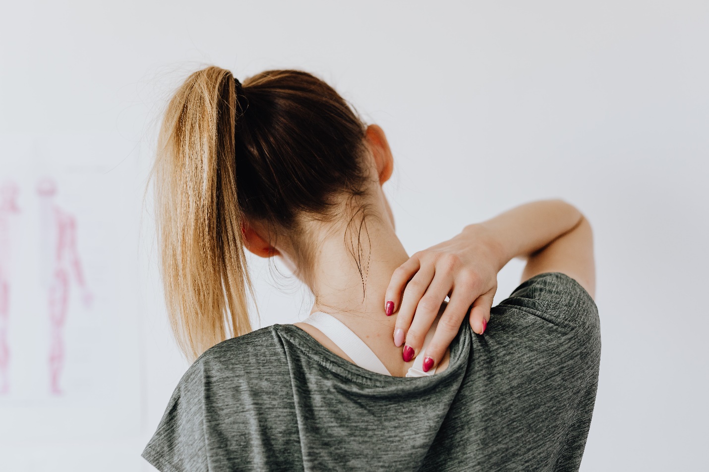 Woman touching her back