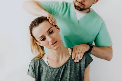 a chiropractor performing treatment to relieve neck pain