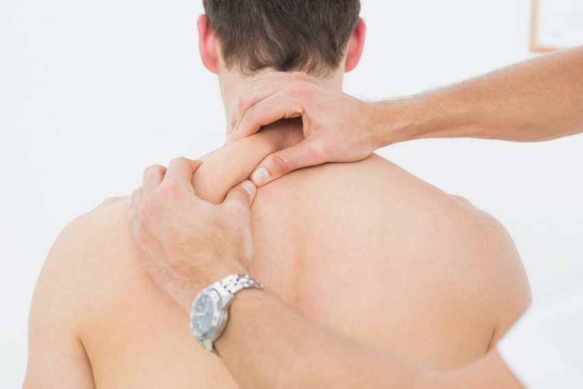 A man getting chiropractic back treatment 