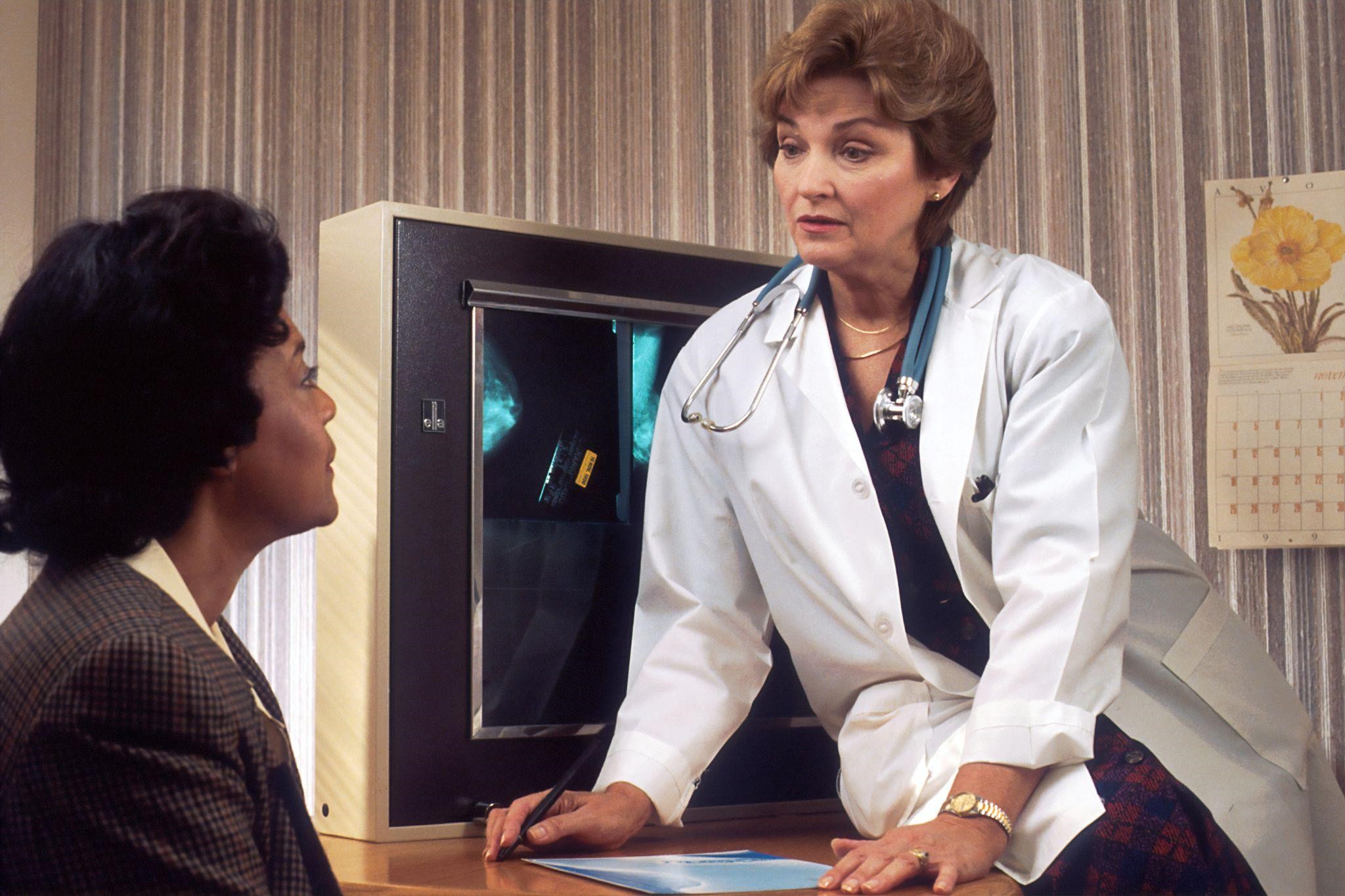 a doctor talking to a patient in their office