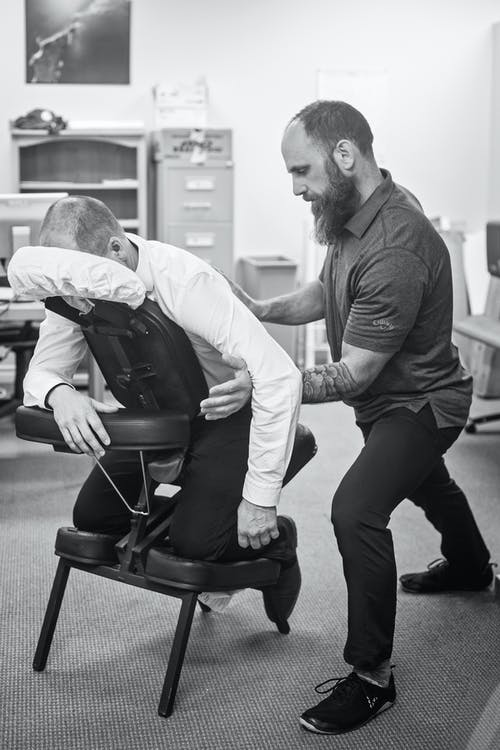 A patient is getting chiropractic massage therapy for low back treatment