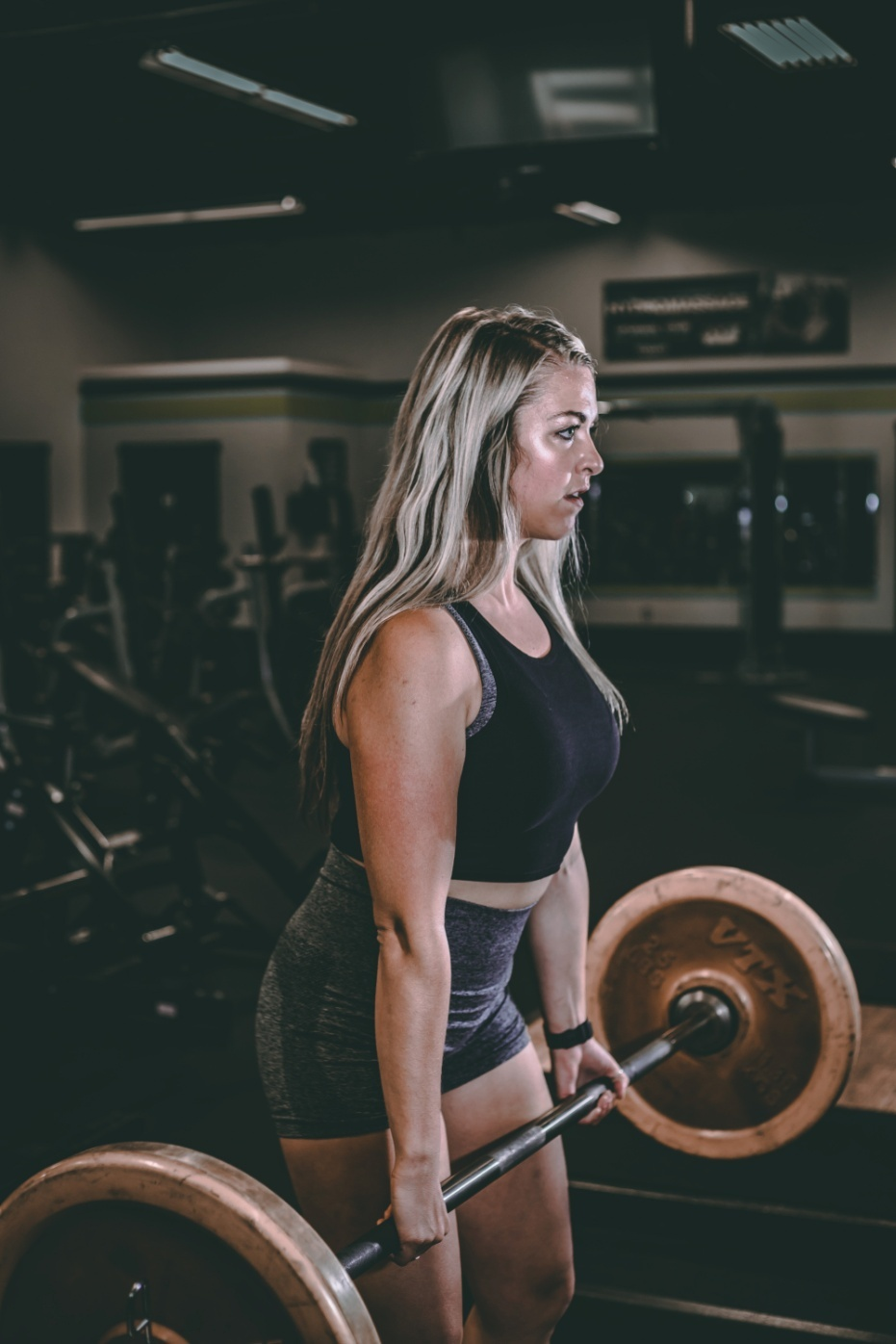 Woman performing deadlifts