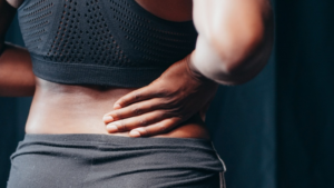 Woman dealing with back pain in Shelbyville, KY