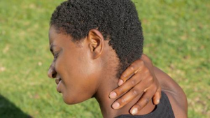 A woman having a neck pain