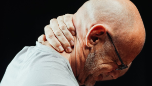 man having neck pain